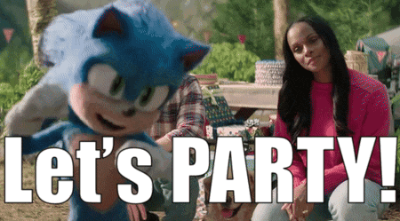 a woman sits next to a sonic the hedgehog mascot and says let 's party !
