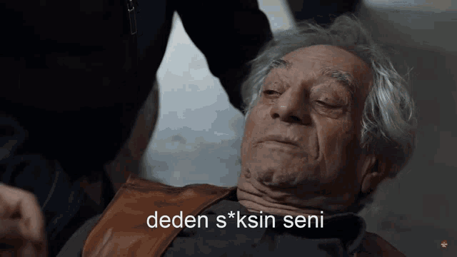 an elderly man laying on the ground with the words deden s * ksin seni written on the bottom