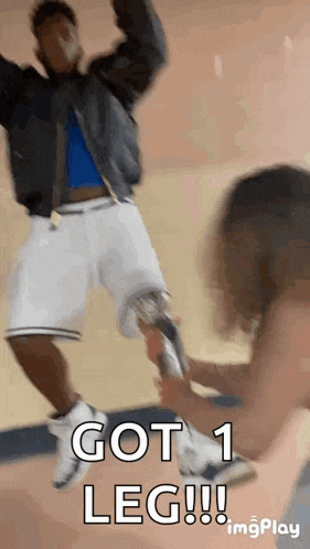 a man with a prosthetic leg jumps in the air