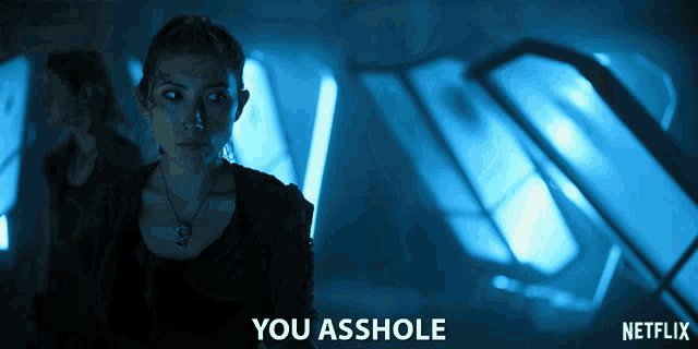 a netflix ad shows a woman in a dark room and says you asshole