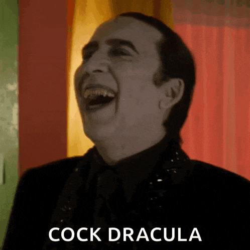 a man is laughing with the words cock dracula written on the bottom