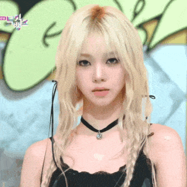 a woman with blonde hair wearing a choker and braided hair