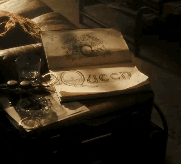 a book is open to a page that says " queen "