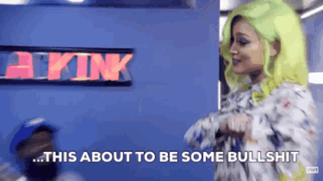 a woman with neon green hair is standing in front of a sign that says apink