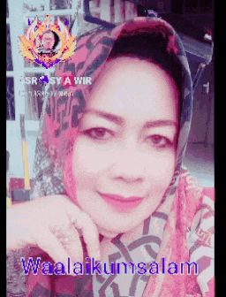 a woman wearing a scarf and a ring is smiling with the words waalaikumsalam below her