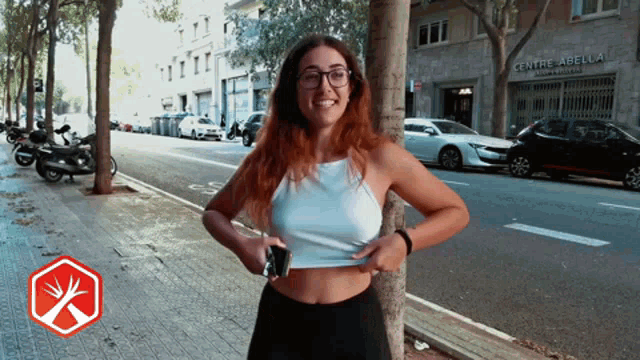 a woman stands in front of a centre abel