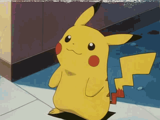 a yellow pikachu with red cheeks is standing on the floor