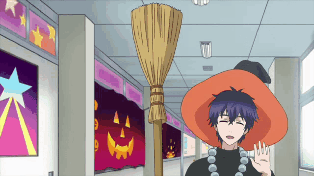 a boy wearing a witch hat is holding a broom in a hallway
