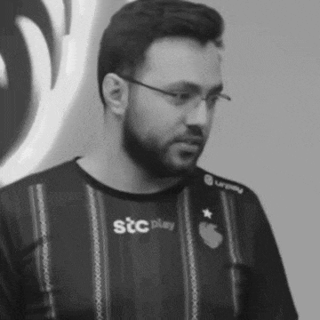 a man wearing glasses and a shirt that says stc pilay