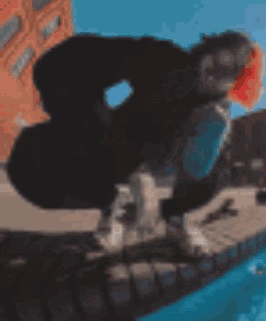 a blurred image of a person in a costume with red eyes
