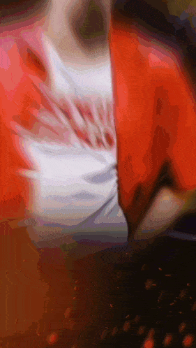 a blurred image of a person wearing a red shirt that says ' chicago ' on it