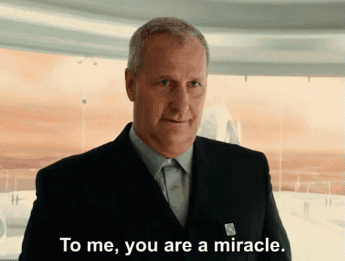 a man in a suit and tie is saying to me you are a miracle