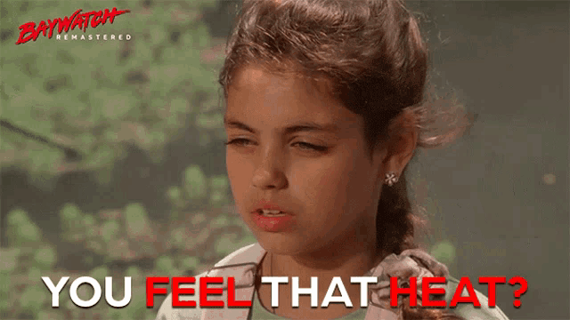 a girl in a baywatch remastered movie is asking if she feels that heat