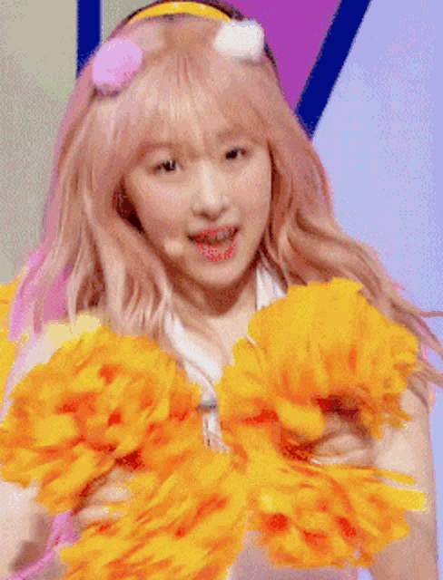 a cheerleader with pink hair and a headband with pom poms