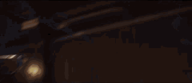 a person is flying through the air with a blue light coming out of them .