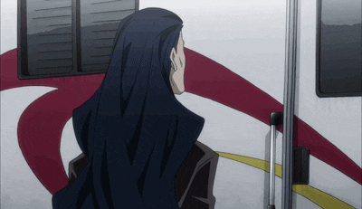 a man with long black hair is standing in front of a red and white rv
