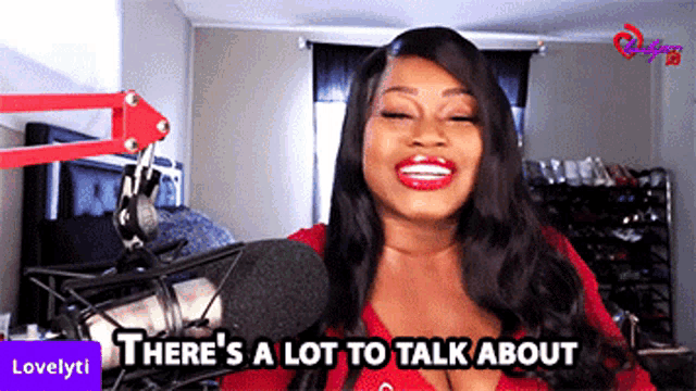 a woman in front of a microphone with the words there 's a lot to talk about above her