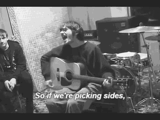 a black and white photo of a man playing a guitar with the words so if we 're picking sides