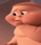 a baby from the boss baby is making a funny face while crawling on the floor .