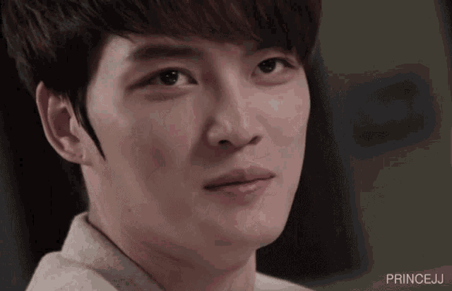 a close up of a young man 's face with princej written below him