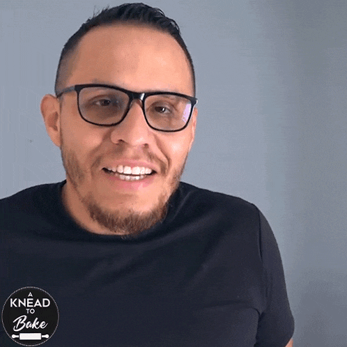 a man wearing glasses and a shirt that says no