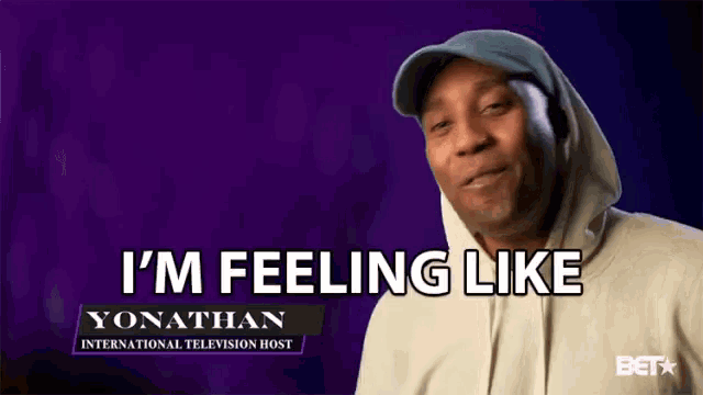 a man wearing a hoodie and hat is saying i 'm feeling like