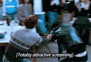 a man in a leather jacket is screaming in front of a crowd of people