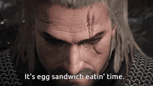 a close up of a man 's face with the words " it 's egg sandwich eatin ' time " below him