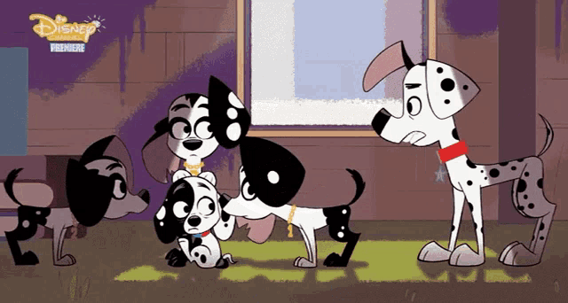 a group of dalmatian dogs standing next to each other with a disney logo on the bottom right