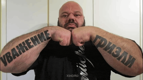 a man has a tattoo on his arm that says ' xandro ' on it