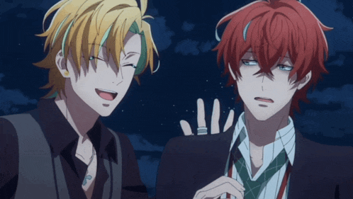two anime characters are standing next to each other and one of them has a ring on his finger