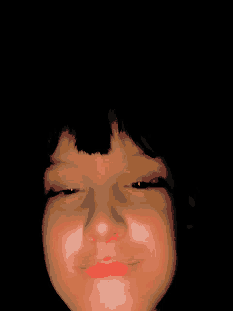 a close up of a child 's face with red lips