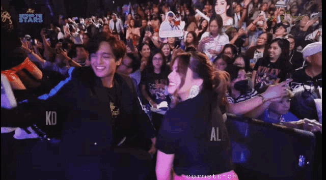 kd estrada and alexa ilacad pose for a photo in front of a crowd