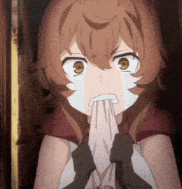 a girl with a towel in her mouth is making a face