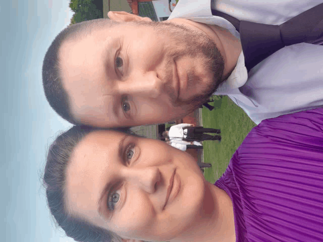 a man and a woman are standing next to each other