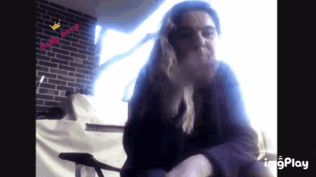 a video of a woman with the words booy boop on the corner