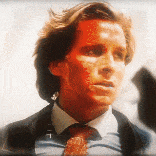 a close up of a man 's face with a red background
