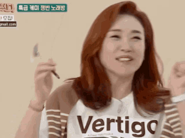 a woman is wearing a shirt that says vertigo