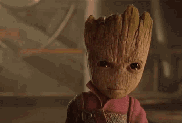 a baby groot from guardians of the galaxy is looking at the camera