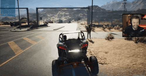 a video game screen shows a man driving a buggy in the desert