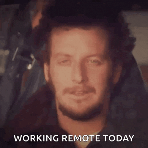 a man with a beard is smiling with the words " working remote today " below him