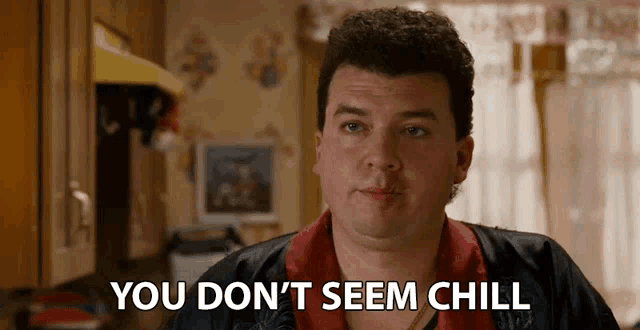 a man in a kitchen with the words " you don 't seem chill " above him