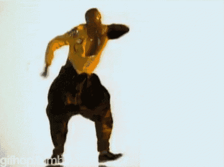 a man in a yellow shirt and black pants is dancing in front of a white background .