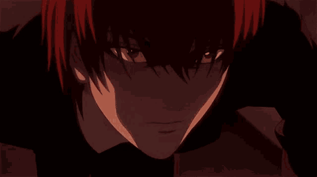 a close up of a person 's red eyes with a glowing light coming out of them .