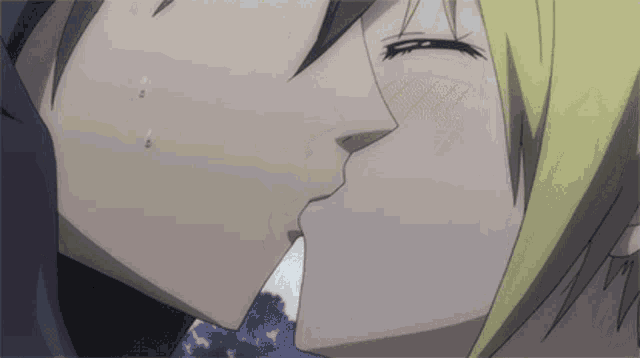 a man and a woman are kissing in a anime scene