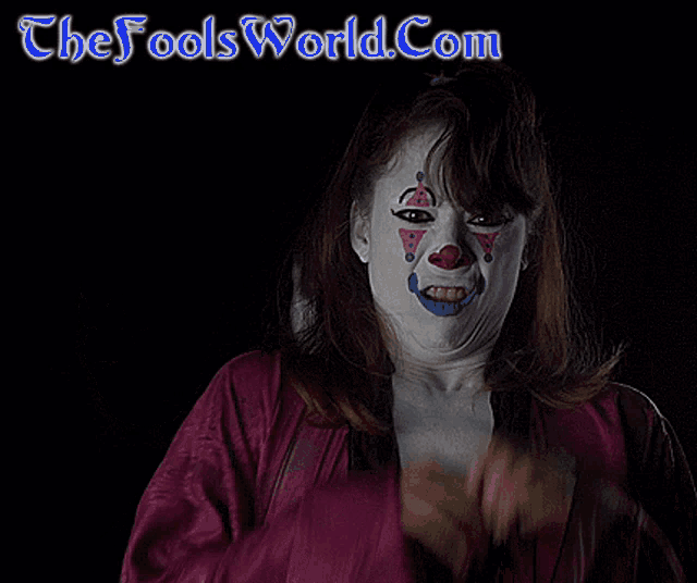 a woman with a clown face painted on her face