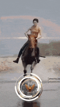 a woman is riding a horse in front of a logo that says university of california