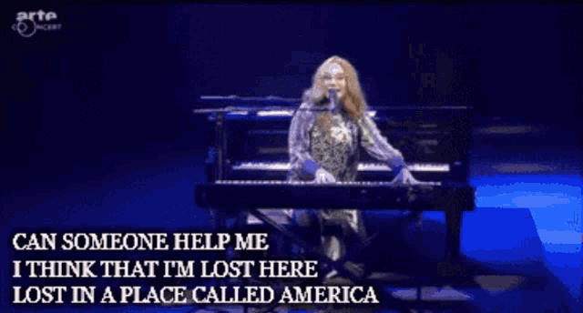 a woman singing into a microphone with the words " can someone help me " at the bottom
