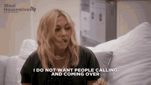 a woman sitting on a couch with the words i do not want people calling and coming over