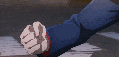 a close up of a person 's fist with buttons on the sleeves